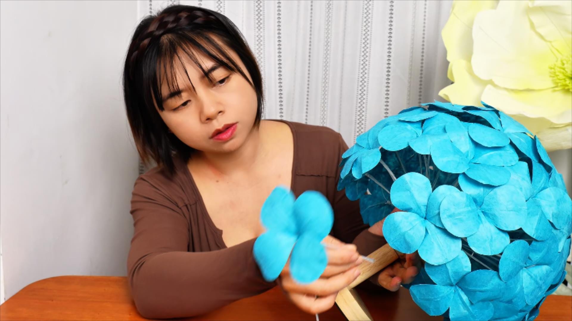 Step-by-step creation of a paper flower from design to final product, showcasing DIY artistry and eco-friendly practices.